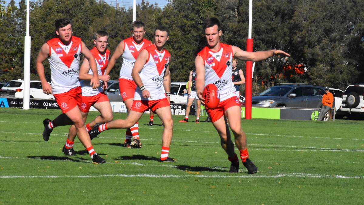 TOUGH ASSIGNMENT: Griffith's James Girdler looks down the line to line during the Swans clash with Collingullie GP. PHOTO: Liam Warren