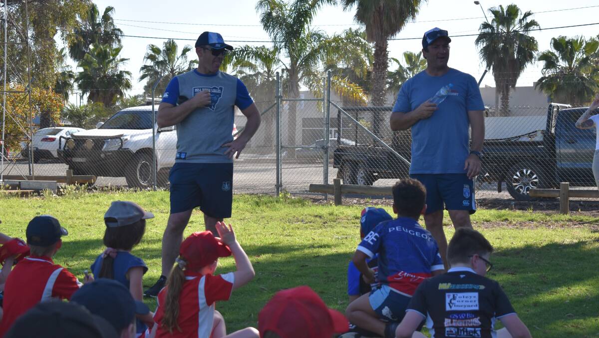 STARS: NSW Blue coach Brad Fittler and Parramatta legend Nathan Hindmarsh quiz the kids on Monday afternoon. PHOTO: Liam Warren