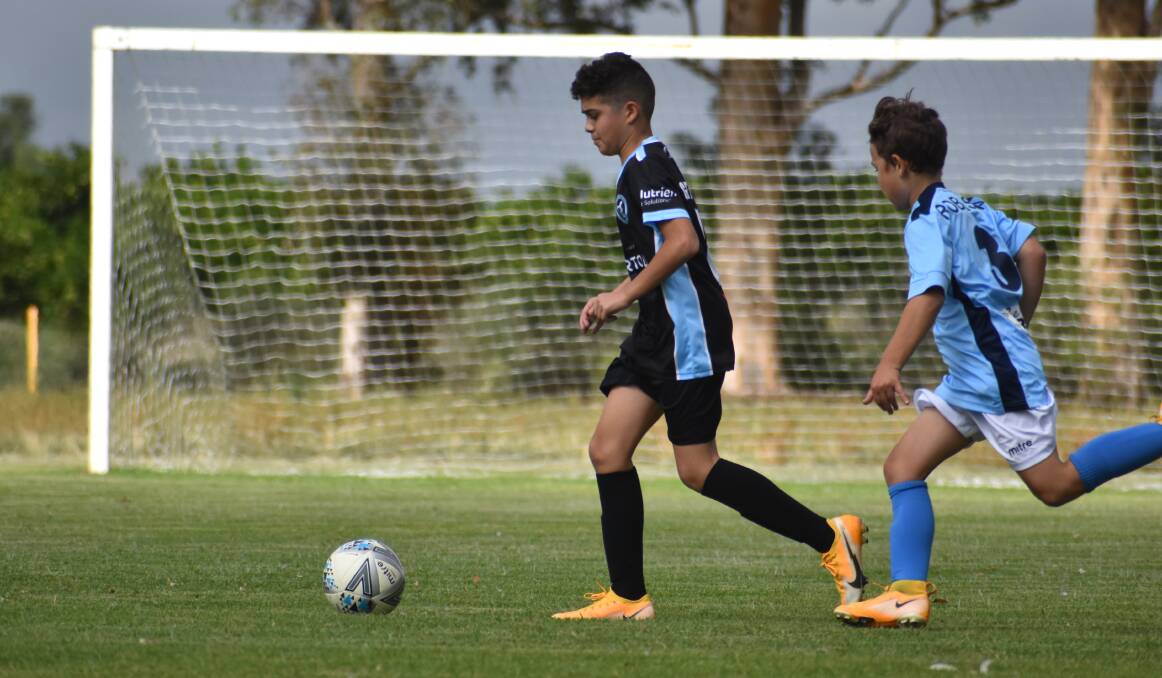 ON TARGET: Nicholas Codemo found the back of the net in the under 13s.