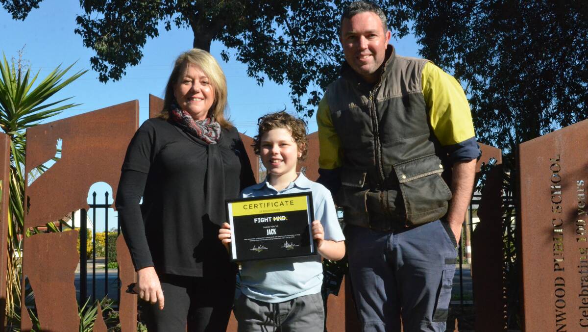GENEROSITY: Jack Webb with dad, Aaron after receiving a certificate from Wendy Keogh after making a donation to help the fight against Motor Neurones Disease. PHOTO: Liam Warren