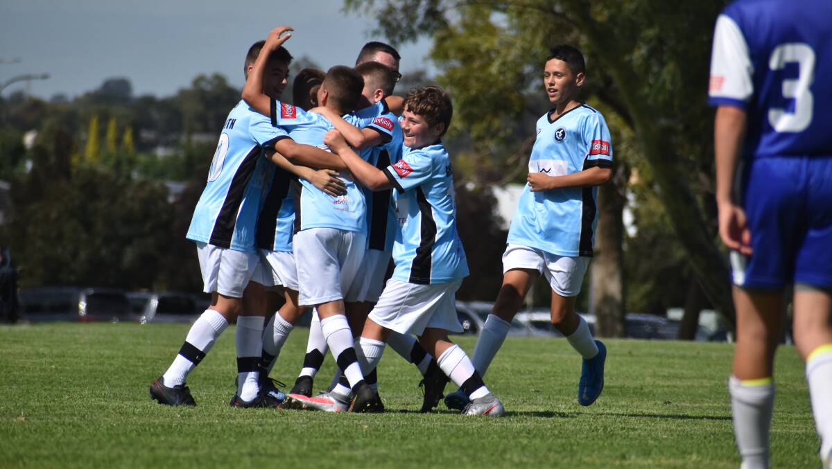 Griffith FC celebrate what turned out to be the match-winner in the 13s