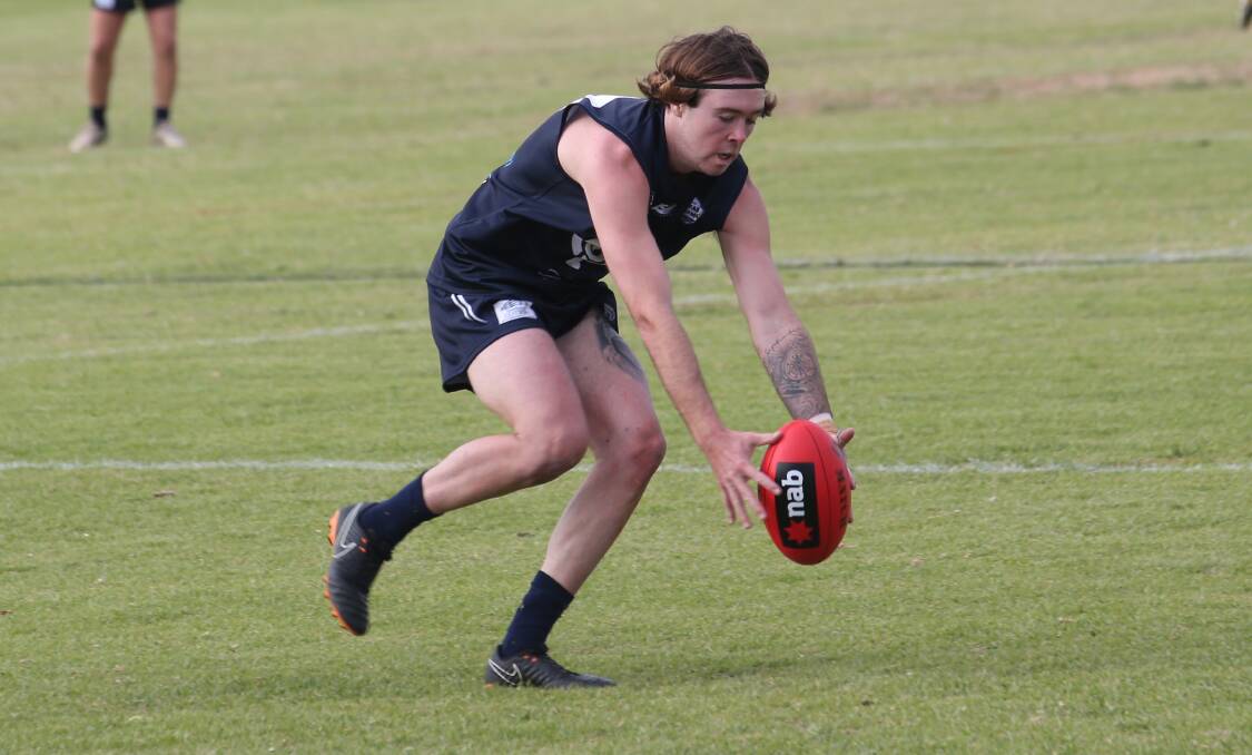 BOILOVER: Coleambally's Jess Spencer looks to get a clean possession during the Blues win over Marrar on Saturday. PHOTO: Anthony Stipo