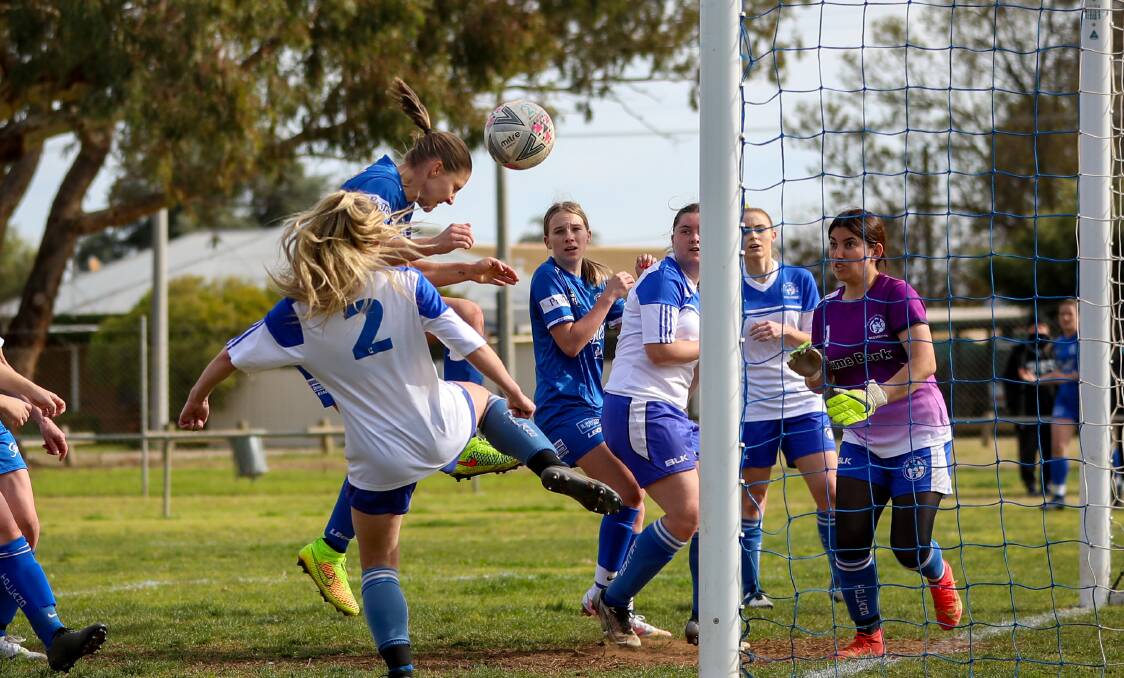 IT'S IN: Tara Ceccato rises up to head the ball home and get Hanwood the three points which sees them rise to the top of the table. PHOTO: Andrew McLean
