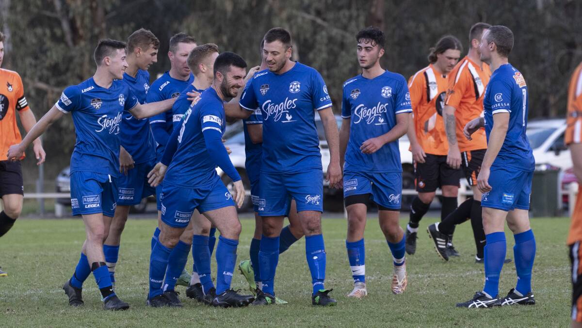ALL SMILES: Hanwood celebrate one of their four goals against Wagga United as they make it four wins to start the season. PHOTO: Madeline Begley