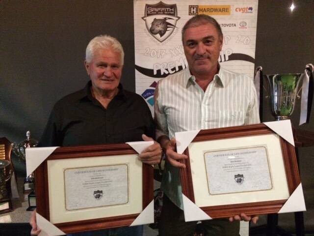 DEDICATION ACKNOWLEDGED: John Sutherland and Jack Draskovic have joined a presigious club after being named life members at the Griffith Black and Whites.