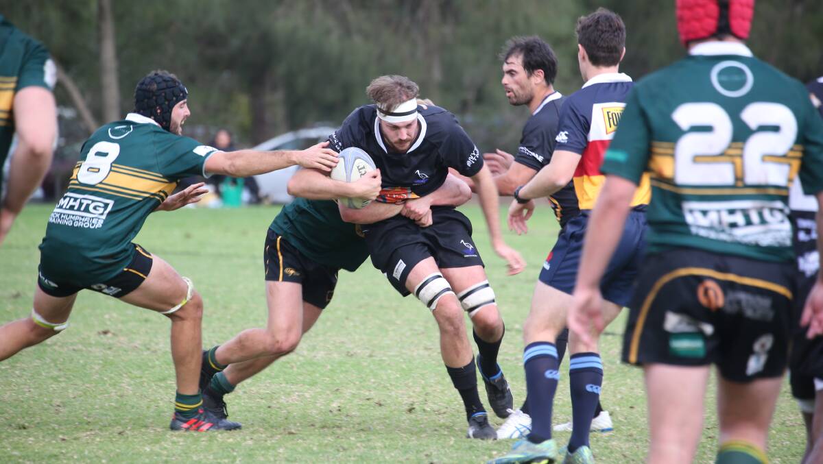 SHOW OF STRENGTH: Griffith's Mitch White looks to get through the Wagga Ag College defensive line. PHOTO: Anthony Stipo