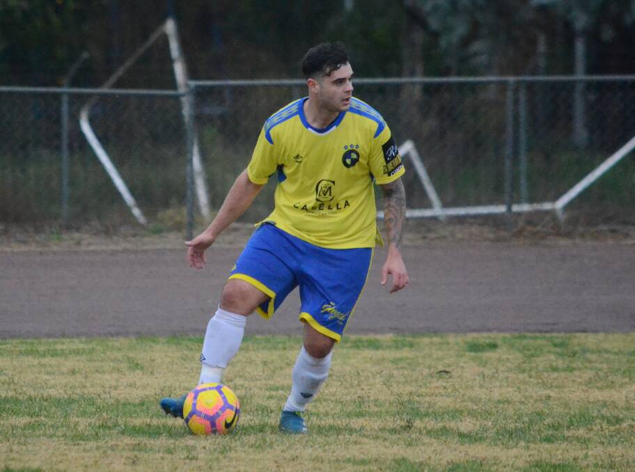 LOOKING AHEAD: Yoogali FC's Daniel Bellato tries to pick out a teammate during his side's clash with West Griffith last weekend. PHOTO: Liam Warren