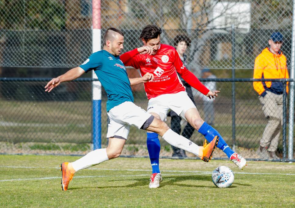 CLOSING DOWN: Rhinos' Joe Preece looks to pinch the ball of his Canberra FC opposition during a clash earlier in the season. PHOTO: Elesa Kurtz