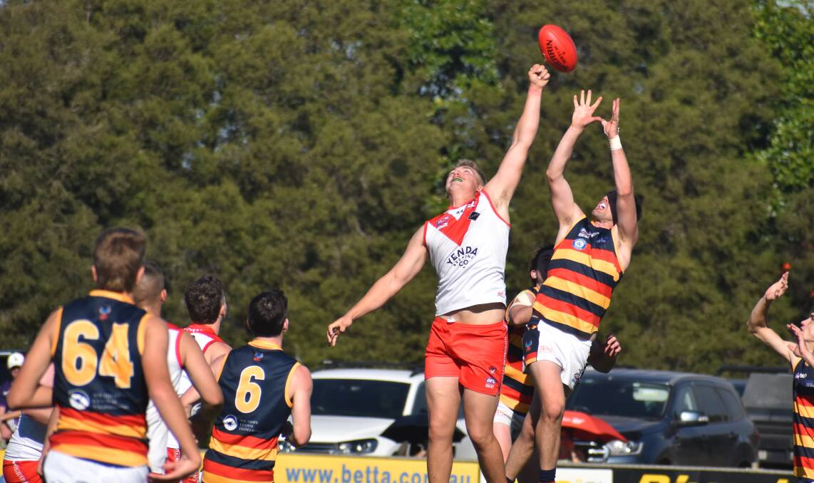 Swans' Nathan Richards competes in the air with Crows' Tom Meline during the Western Derby at Exies Oval. Picture by Liam Warren