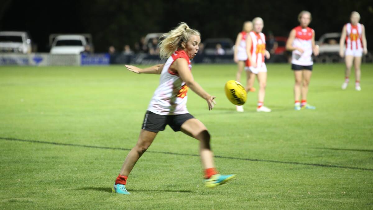 LONG BOMB: Swans' Maddi Smith looks to gain her side some metres with a penatrating kick in their grand final loss to CSU last season. PHOTO: Anthony Stipo