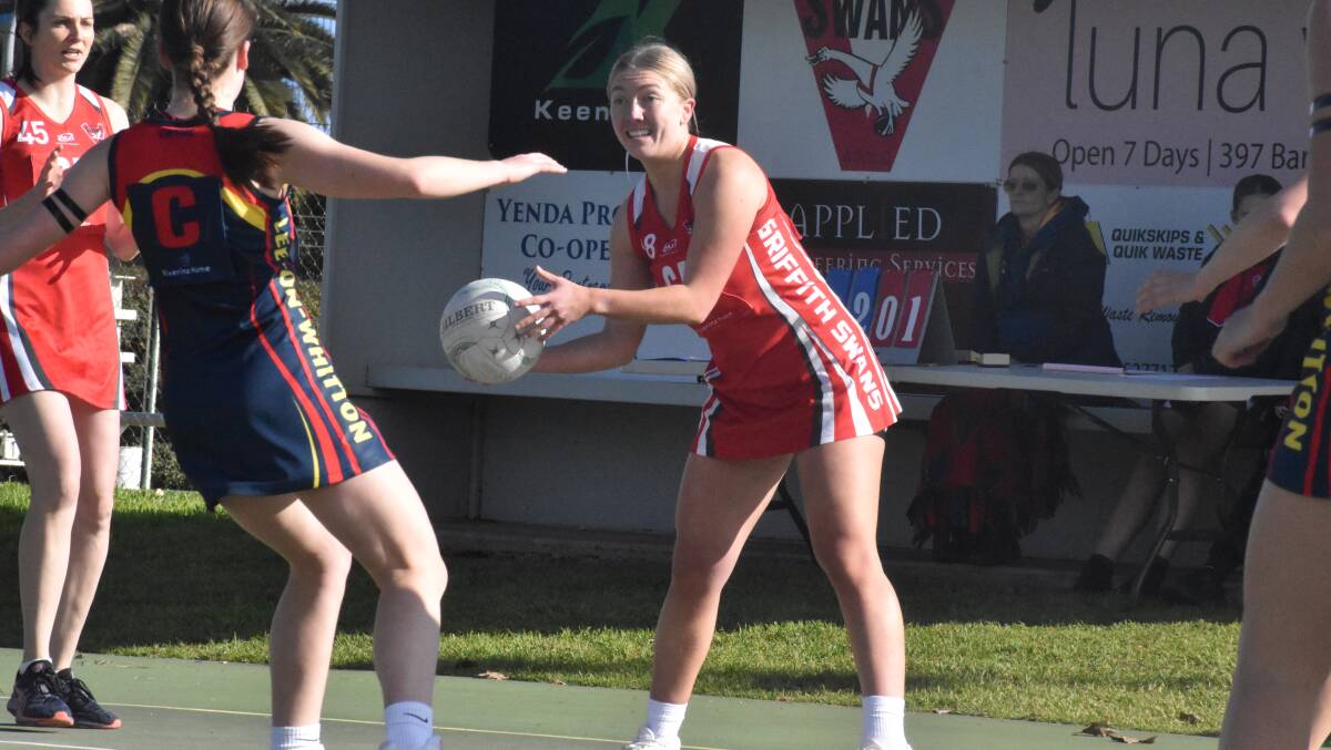 QUICK MOVEMENT: Swans' Jenna Richards looks to find an open teammate during the local derby with Leeton-Whitton. PHOTOS: Liam Warren