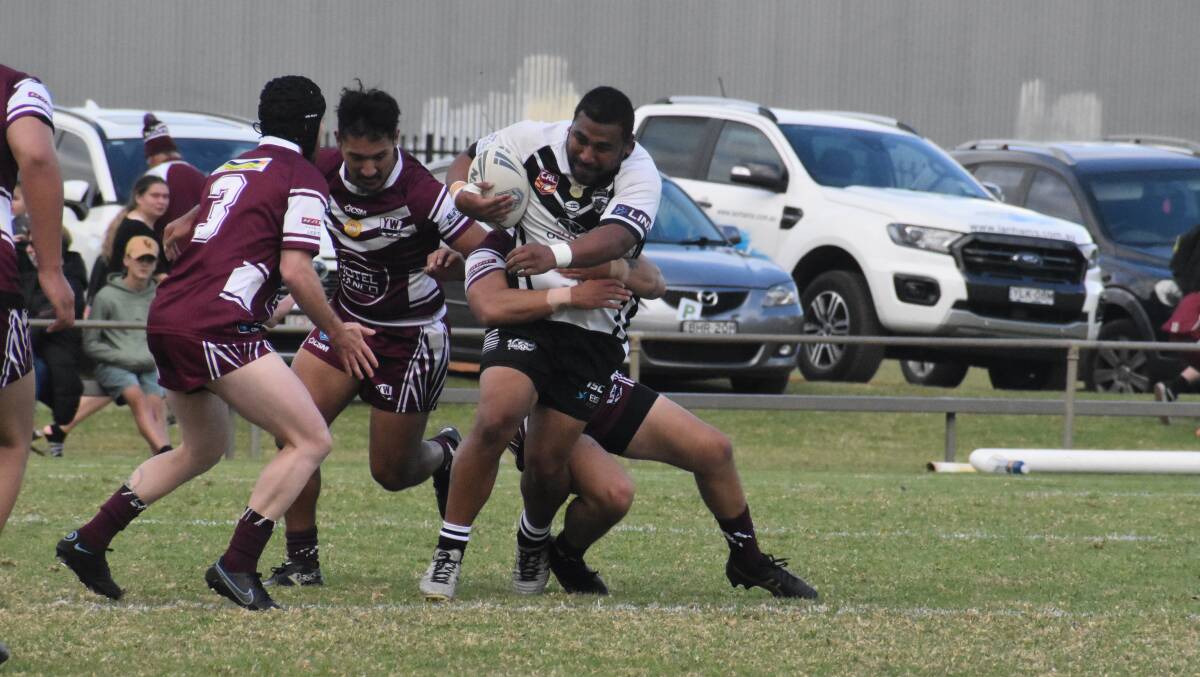 PUSH: Black and Whites' Veti Mataa attempts to barge his way through the Yanco-Wamoon defence in a one-sided affair at Solar Mad Stadium. PHOTO: Liam Warren