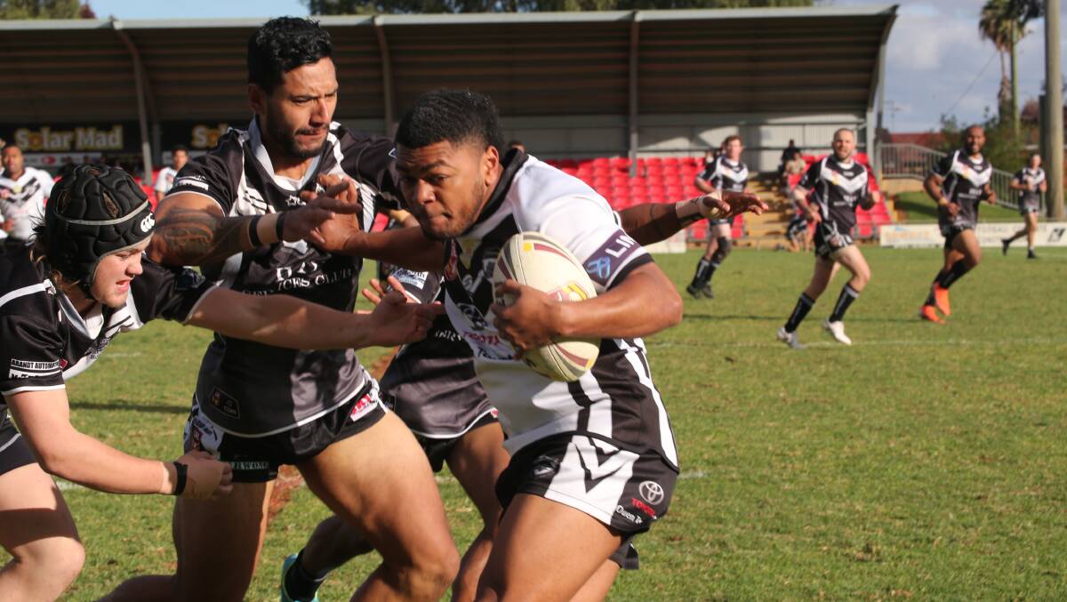 IN A SPIN: Black and Whites' Vereaqali Lewenioila tries to evade the Hay defence. PHOTO: Anthony Stipo