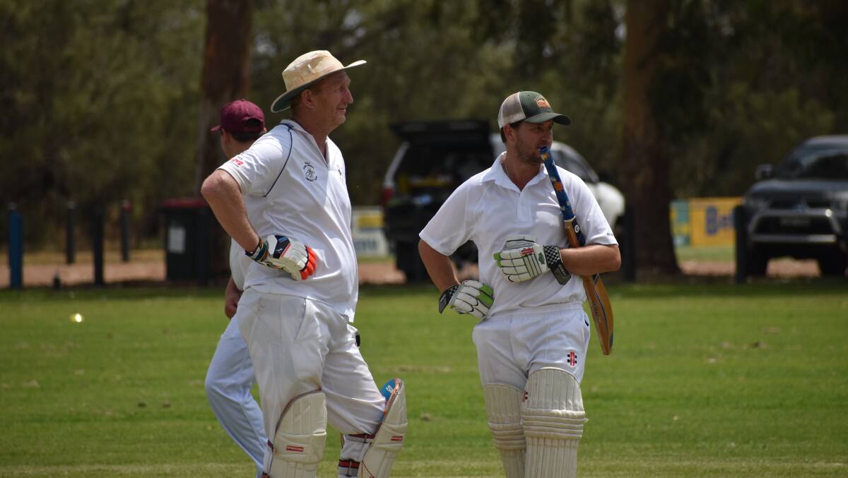 TALKING TACTICS: Diggers' Trevor Richards and Matt Crack discuss their plans inbetween overs during their side's win over Hanwood. PHOTO: Shaun Paterson
