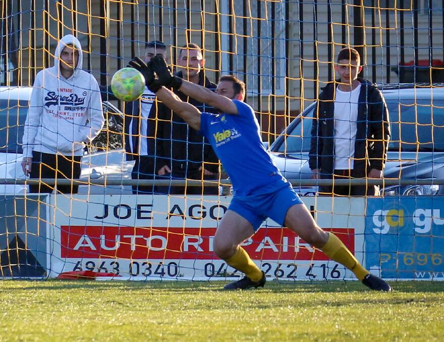 BIG SAVE: Yoogali SC's Michael DePaoli makes the crucial intervention in the penalty shootout which saw his side advance to the grand final. PHOTO: Andrew McLean