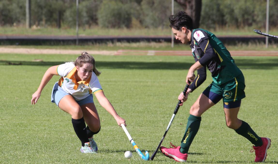 Griffith Retirement Estate's Hannah Shrives and Easts' Davina Guidolin battle for possession in the latest round of the women's competition