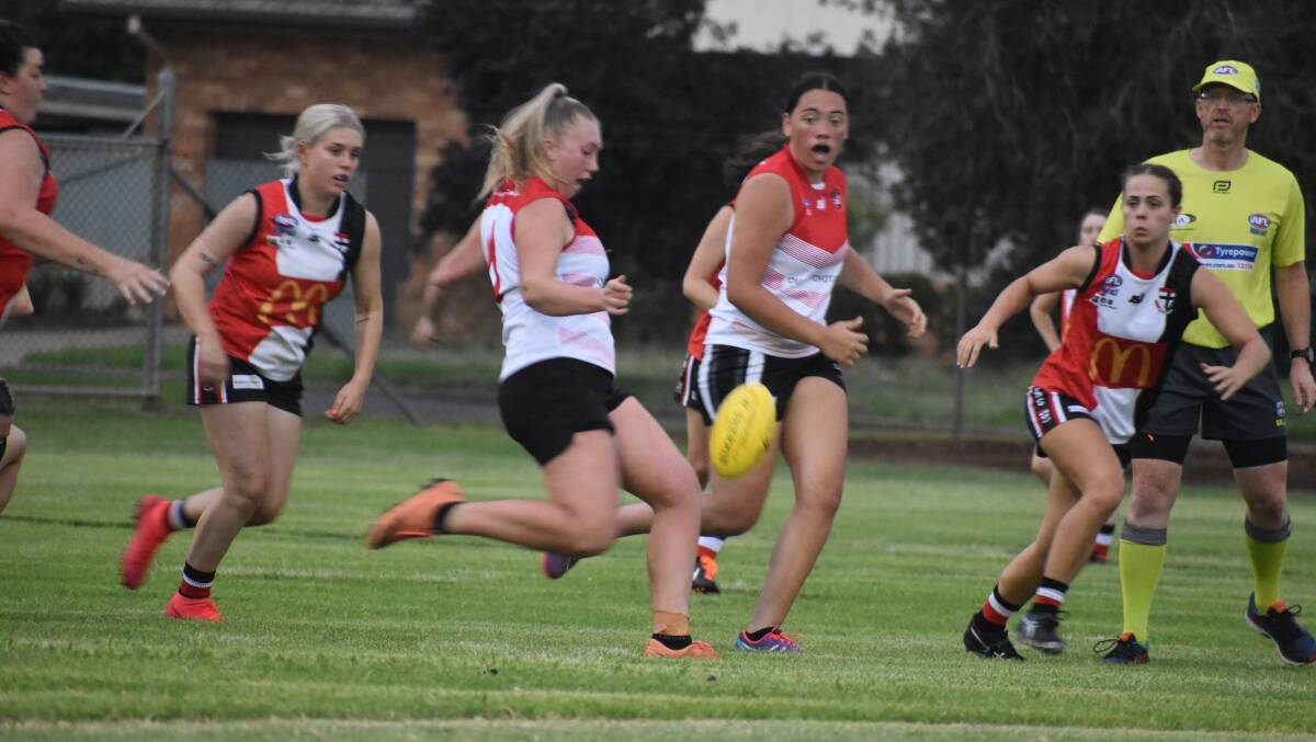 LONG BOMB: Swans' Jenna Richards looks to find a teammate downfield during their opening game of the season against North Wagga. PHOTO: Liam Warren