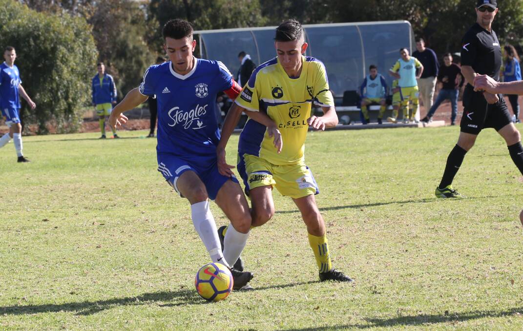 STANDING TALL: Michael Cimador was a key component in Hanwood Blues' win over Yoogali FC Two on Sunday afternoon. PHOTO: Anthony Stipo