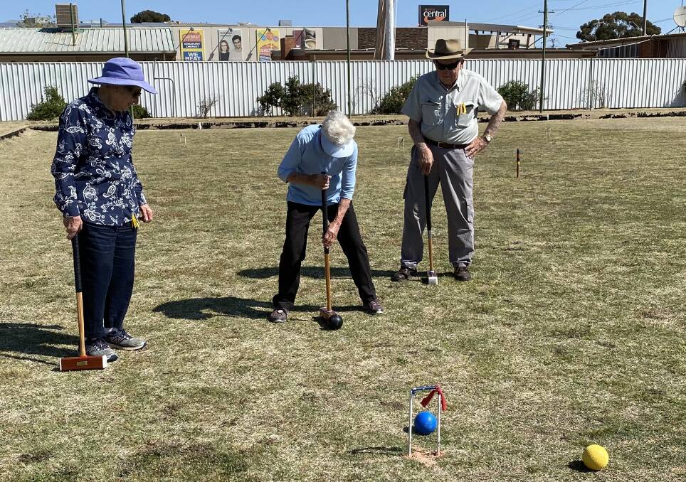 TAKING AIM: U3A members playing Croquet on the old bowling greens next to the Griffith Visitors Centre. PHOTO: Contributed