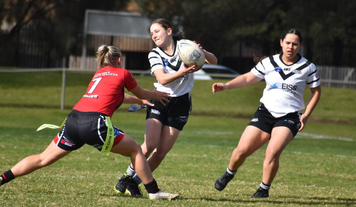 AVOIDING: Panthers' Lara Rossetto tries to escape the West Wyalong defence. PHOTO: Liam Warren