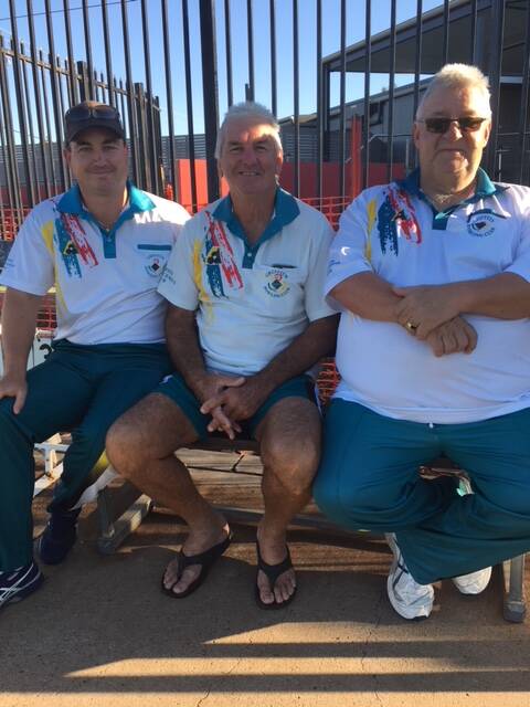 HAVING A ROLL: Exies' pennants players Terry Young, Garb Saunders and Ross Elliott.
