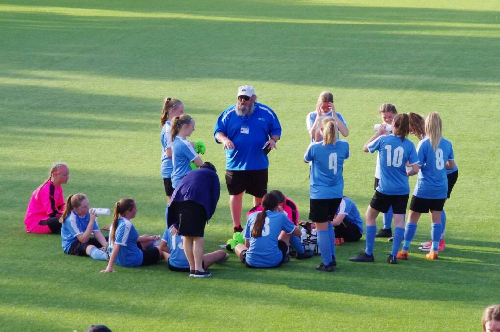 REAL TALK: Coach Rod Buik adresses the girls during a halftime chat