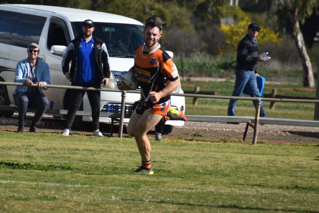 HOLDING ON: Waratah Tigers have kept their season alive and two tries to Tom Sellars saw them pick up a 52-10 win over West Wyalong. PHOTO: Liam Warren