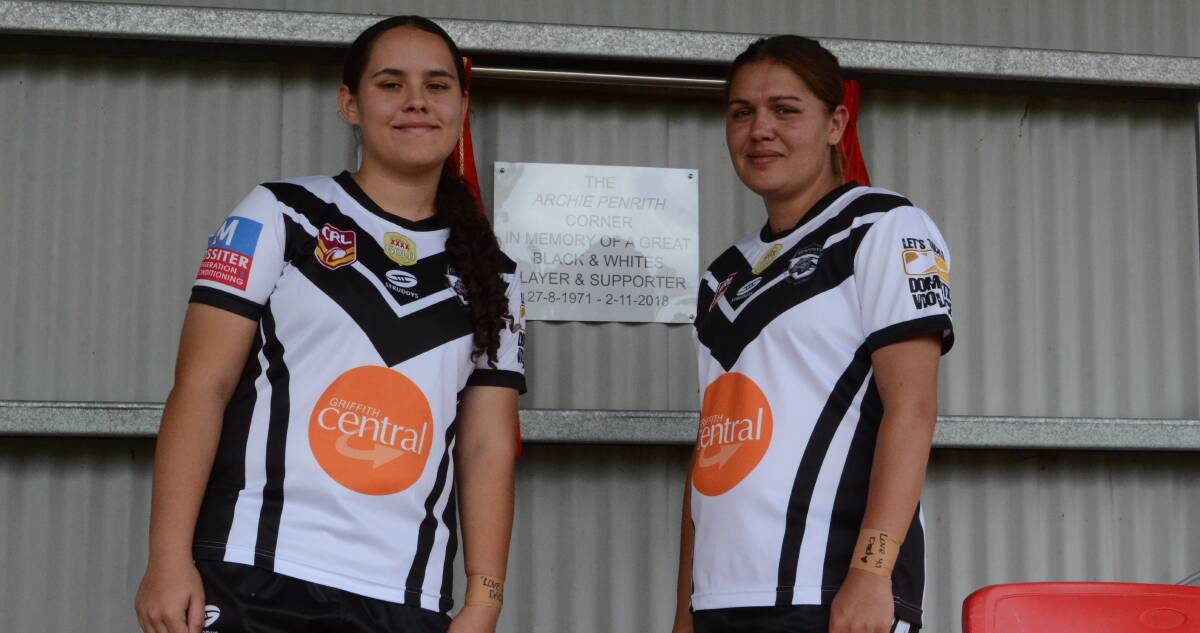 SUPPORTER HONOURED: Hollie Penrith and Ashleigh Harris unveil the plaque honouring the long term dedication of Archie Penrith. PHOTO: Liam Warren