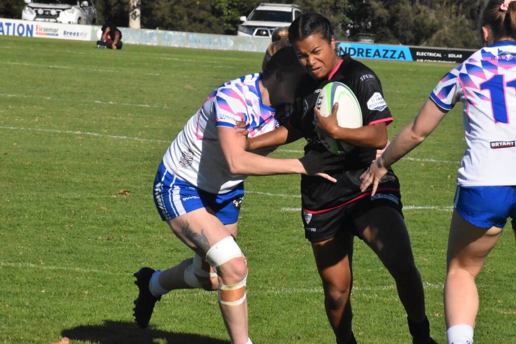 BREAKTHROUGH: Blacks' Ua Ravu tries to push her way past the Wagga City on her way to a three-try performance. PHOTO: Liam Warren