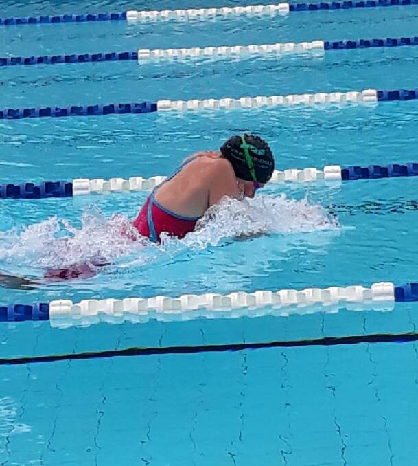 STRONG STROKES: Samantha Taylor on her way to a record breaking race in the 100m breaststroke at the Riverina carnival. PHOTO: Supplied