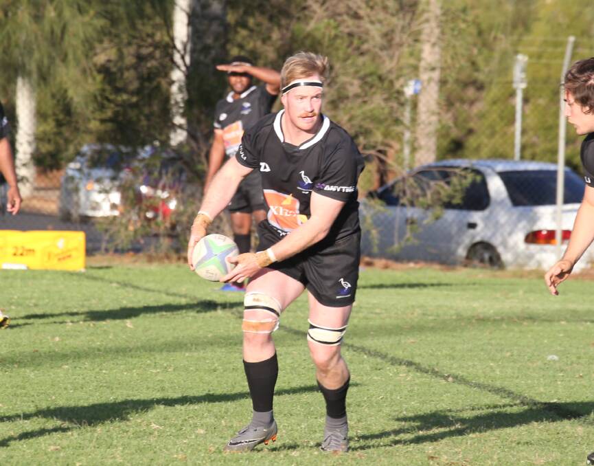 HANDING OFF: Blacks' Andries DeMeyer looks to set a teammate in motion against Albury in their last game before the representative bye. PHOTO: Anthony Stipo