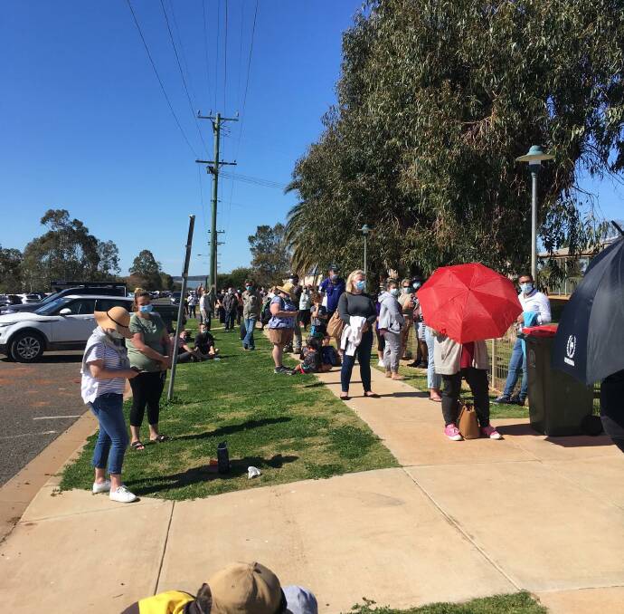 Residents line up for testing at Lake Cargelligo after a woman with COVID-19 visited the area. Picture: MLHD