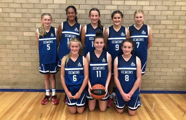 UNBEATABLE: The under 13s Griffith Demon girls who were able take out the John Martin Country Basketball Tournaments division 2 grand final.