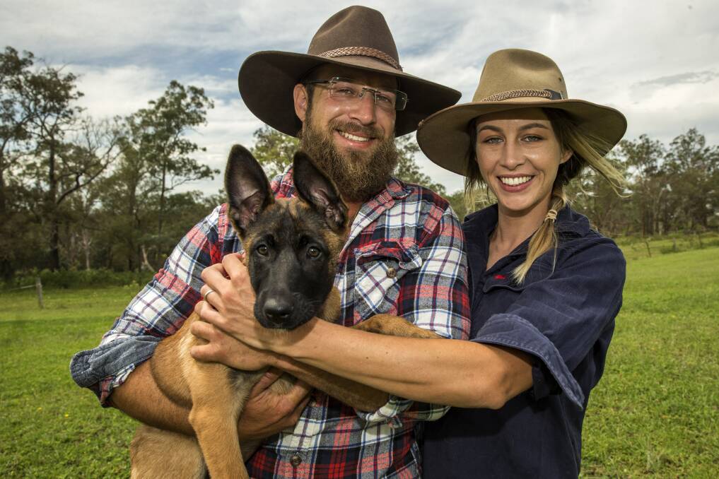 Bear and Chantelle Hasofer with Kyra the puppy. Picture: Geoff Jones