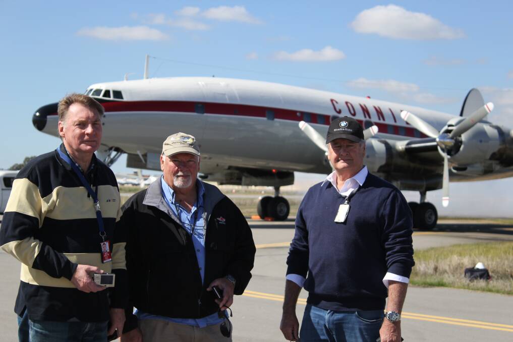 Wheels up: Wagga City Aero Club president Geoff Breust with fellow members John Smith and Malcolm Robertson at the tale-off of one of two flying Constellations. 