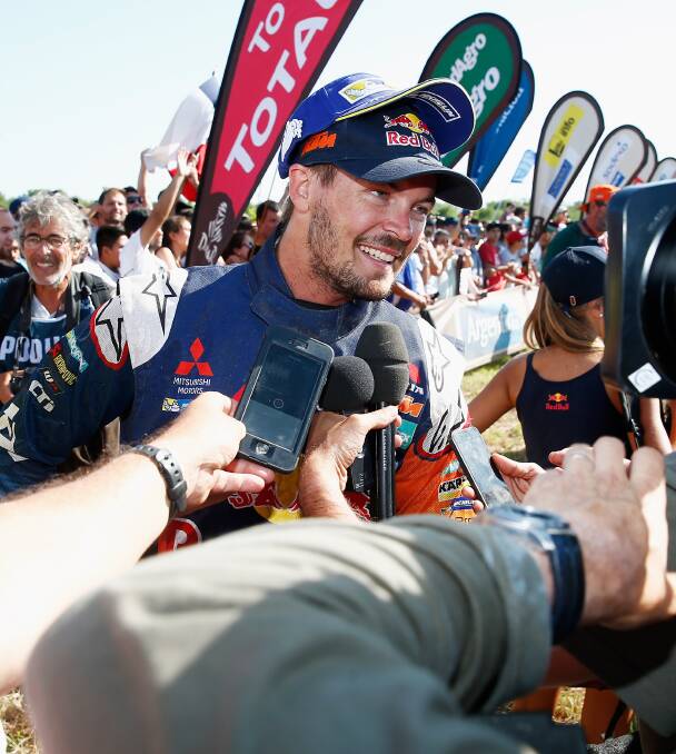 CHAMPION: Toby Price is mobbed after crossing the finish line in Rosario, Argentina, to win the Dakar Rally. Picture: Getty Images