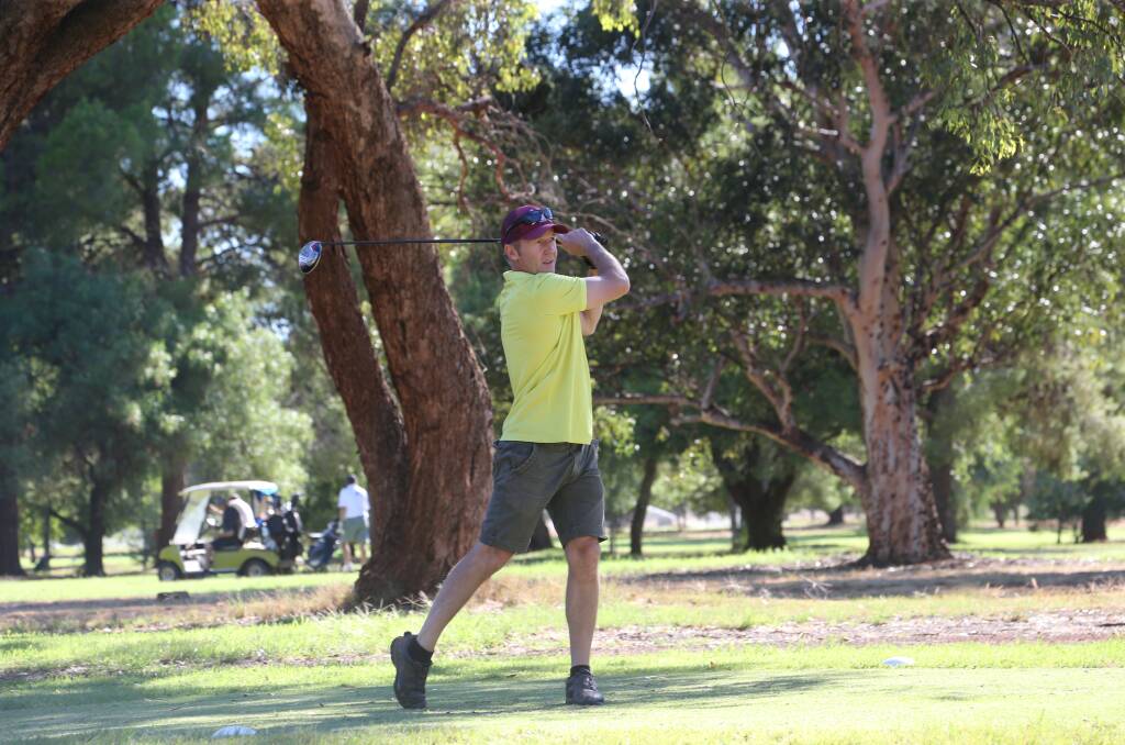 MELLOW YELLOW: ​Grant Gyles keeps his eye on the ball at Griffith Golf Club at the weekend. Picture: Anthony Stipo