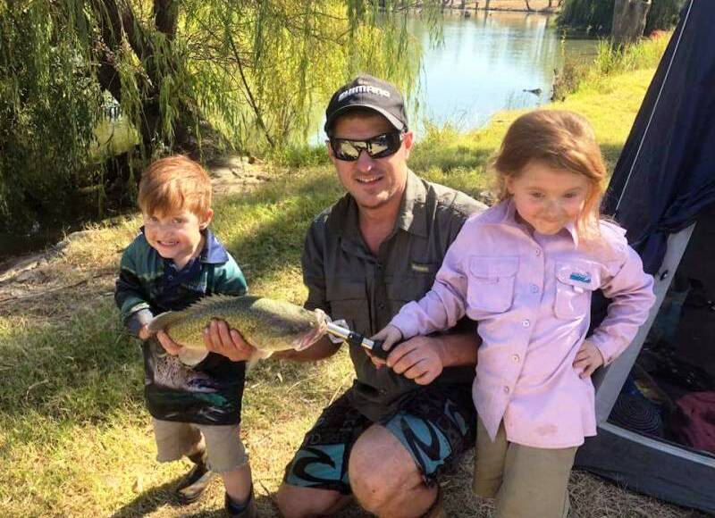 FAMILY FUN: Bryden and Jameson McAllister with a cod from the Murrumbidgee. Send your pictures to craig@waggamarine.com.au or 0419 493 313. Picture: Contributed