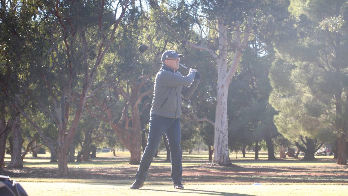 DAY ON THE GREEN: Andrew Mott enjoys a round of golf earlier this month at the Griffith course. Picture: Anthony Stipo