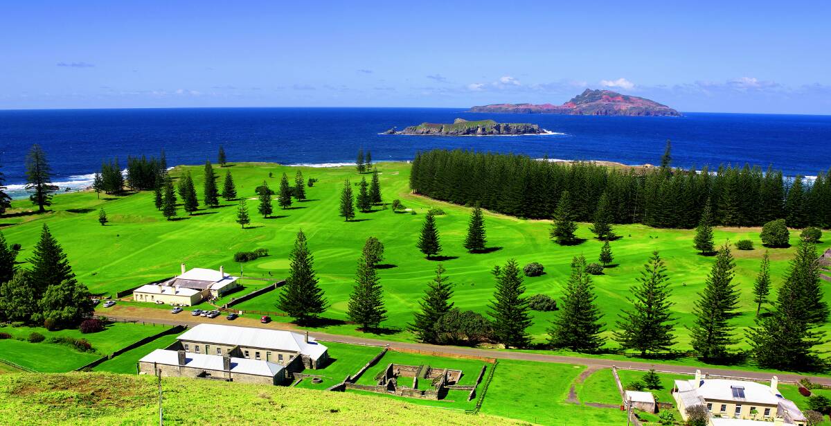 Idyllic sight: The lush green spaces and historic convict era buildings of Norfolk Island are a long way from the dusty Riverina. PHOTO: NORFOLK ISLAND TOURISM