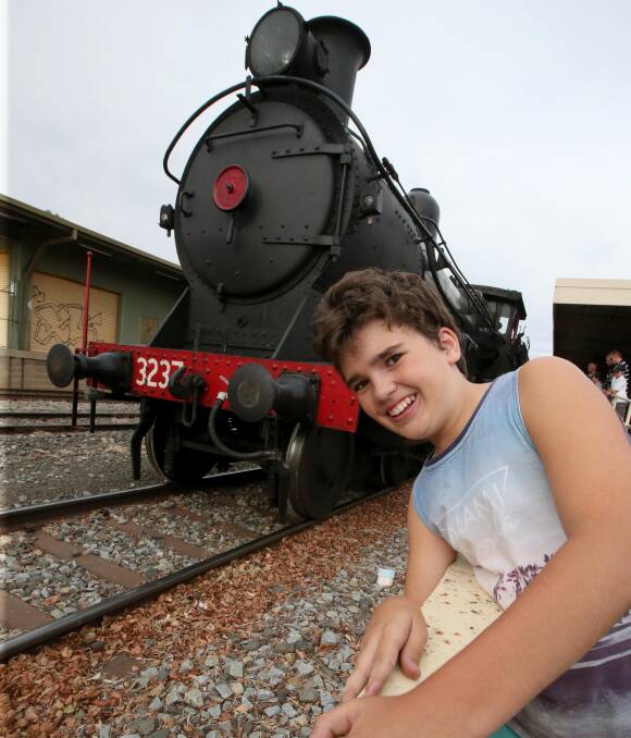 SEEING DOUBLE: Lachlan O'Grady enjoys watching the Lachlan Valley steam train chug its way into Griffith for the Easter long weekend. Picture: Anthony Stipo.