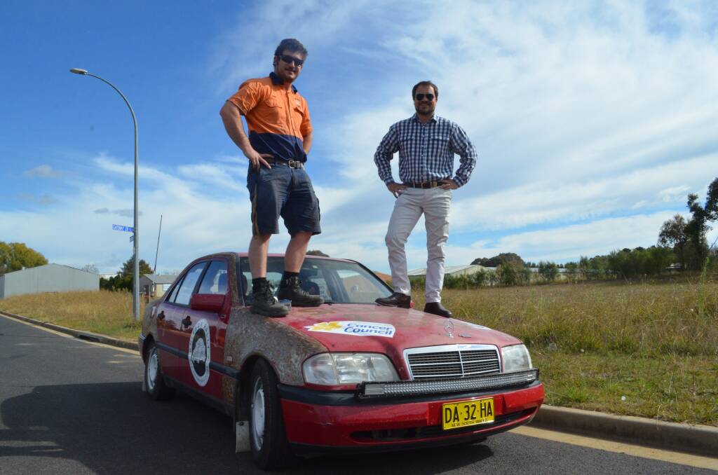 TOUGH TASK: Sean Ryan and Henri Sutton are hoping to take this car 4,000km from the Gold Coast to Alice Springs to raise money for the Cancer Council. Photo: RILEY KRAUSE.