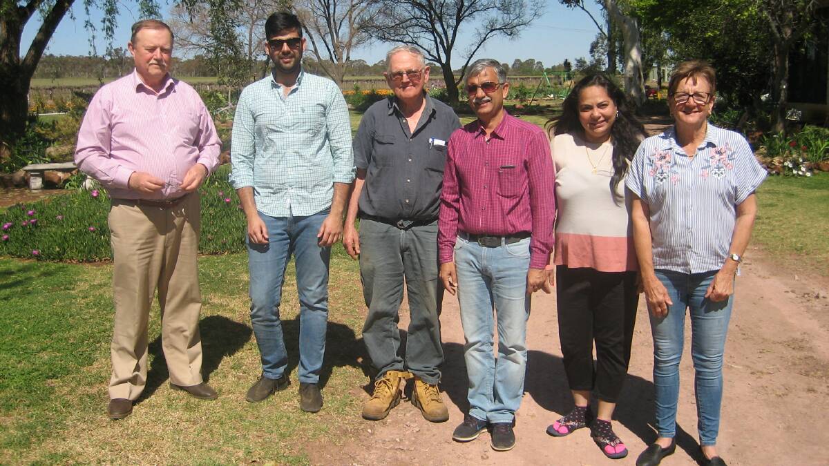 VISIT AND LEARN: John Collins (left) with a farming family from the Punjab, at a Corbie Hill farm prior to 2020's travel restrictions. The visitors were interested to see pressurised irrigation systems at work. Photo: Contributed 
