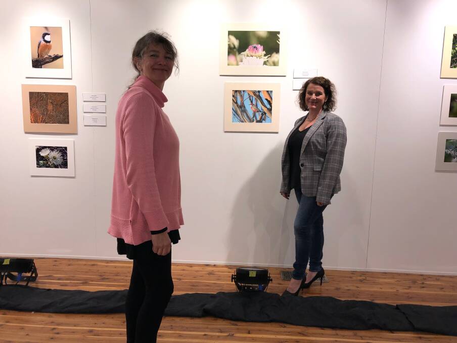 SUPPORT: Aanya Whitehead from Western Riverina Arts (left) and Suesann Vos from Leeton Shire Council viewing the Murrumbidgee Field Naturalists photography exhibition at the new Leeton Art Gallery and Museum.