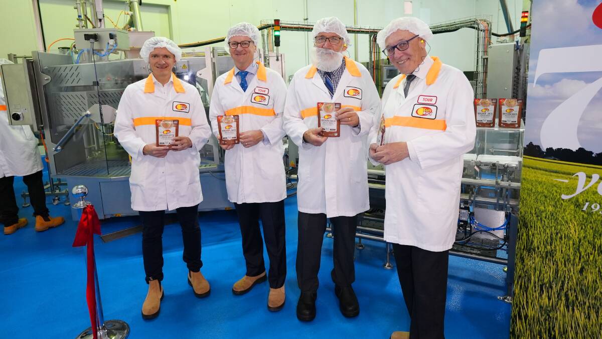 DELIVER: SunRice chief executive officer Rob Gordon (second from left) at the Leeton plant earlier this year. Photo: Supplied