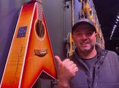 Ago Furore with a guitar used by the famous guitarist Tommy Emmanuel. It was taken at the Maton Guitar Exhibition at Sydney Powerhouse Museum. Picture supplied 