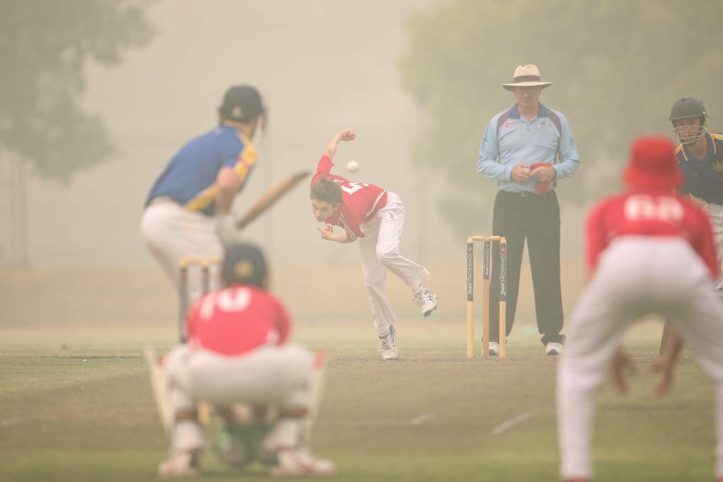 UP IN SMOKE: Two local teams from Albury playing in the horrible conditions over the weekend.