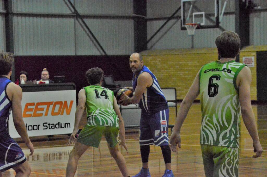 VALUED: Griffith Demons' Arch Cullen leads the victorious team from the sideline and on the court. PHOTO: Liam Warren