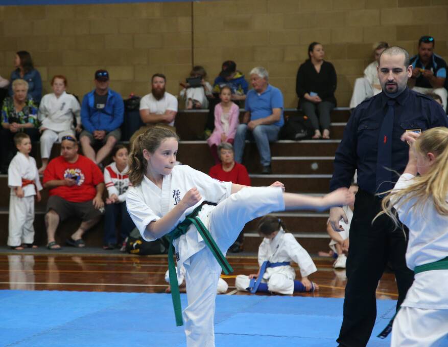 POWERFUL: Eliza Mitchell competing at the 2018 Kyokushin Karate Championships. PHOTO: Anthony Stipo