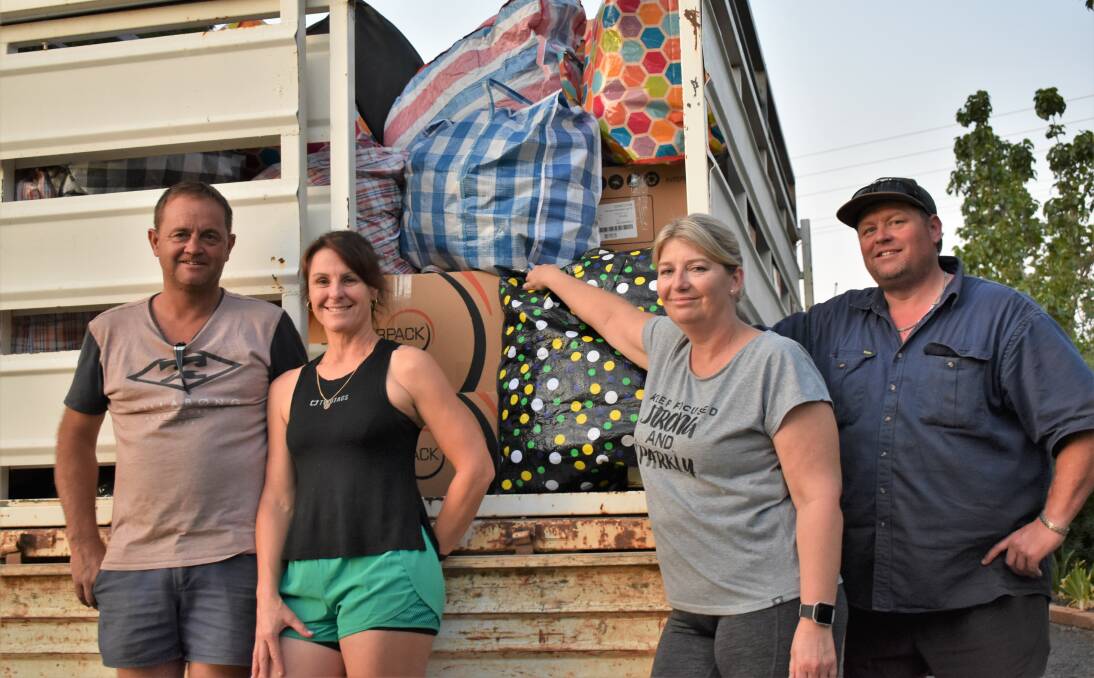 HELPING HANDS: Wayne 'Nudge' Nancarrow, Toni Nancarrow, Lisa Rand and Michael 'Randy' Rand took the donations to Yass. PHOTO: Shaun Paterson